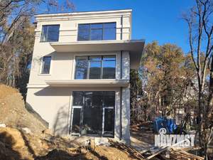 Коттедж 245м², 3-этажный, участок 5 сот.  