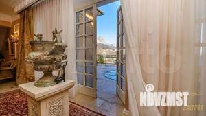 Коттедж 1250м², 3-этажный, участок 18 сот.  